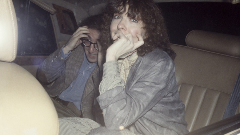 Diane Keaton sits in a car with Woody Allen
