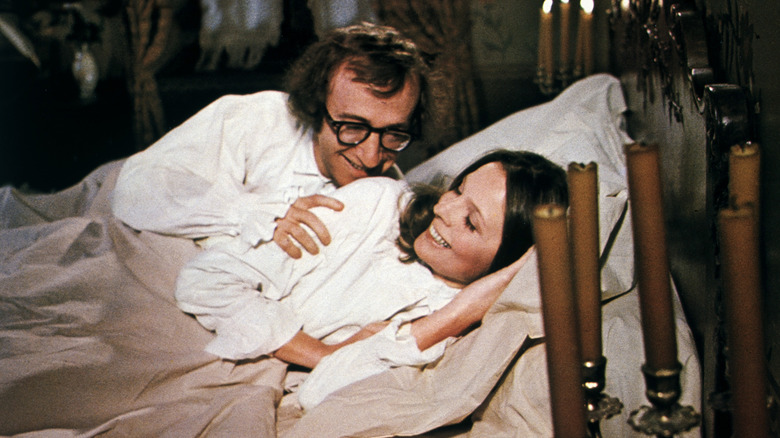 Woody Allen and Diane Keaton laughing in bed together