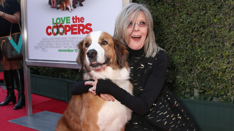 Diane Keaton hugging dog
