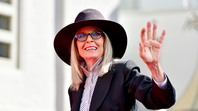 Diane Keaton smiling and waving