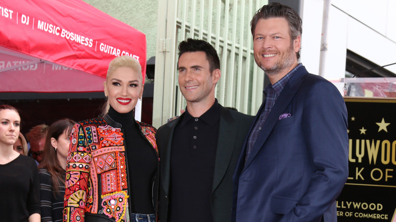 Gwen Stefani, Adam Levine, and Blake Shelton smiling