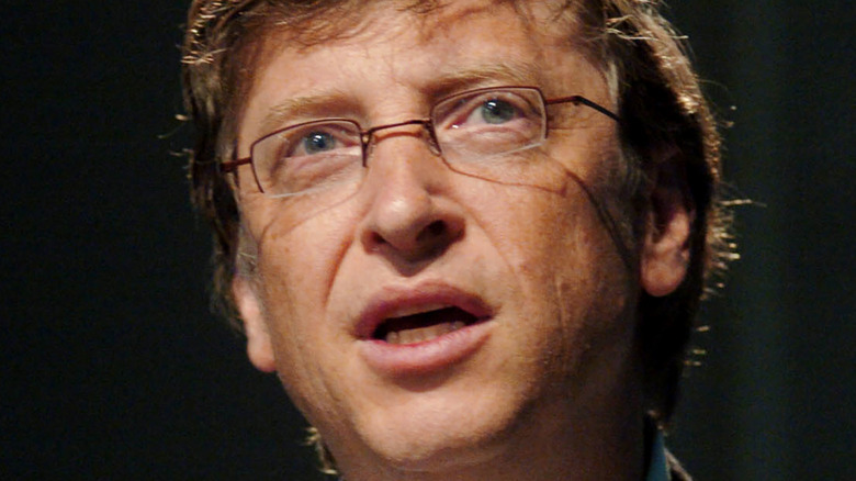 Bill Gates with a neutral expression