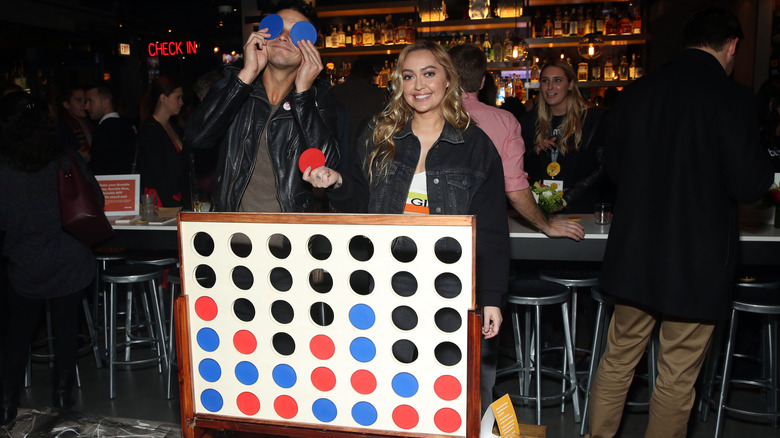 Wells Adams and Brandi Cyrus posing