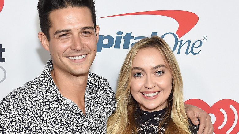 Brandi Cyrus and Wells Adams smiling