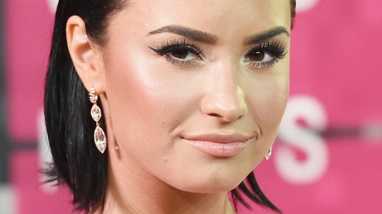Demi Lovato smirking