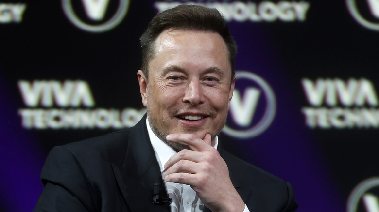 Elon Musk hand on chin