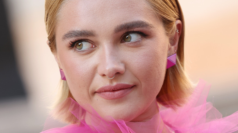 Florence Pugh wearing pink geometric earrings