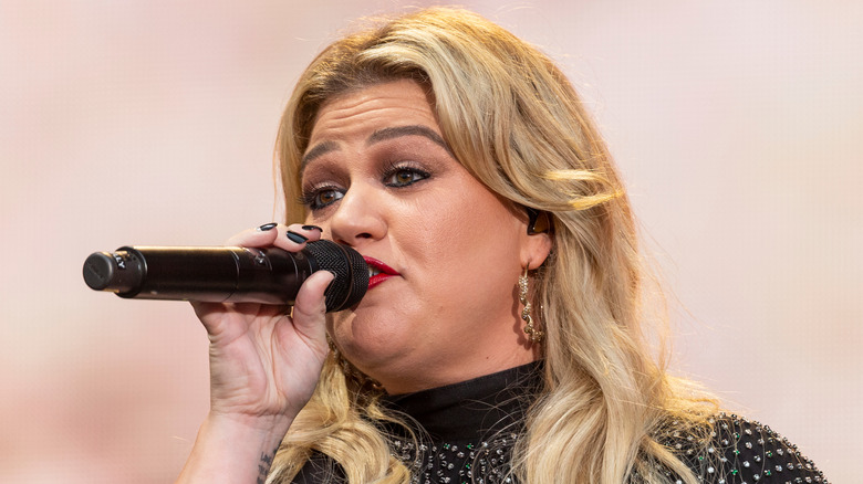Kelly Clarkson performs on stage