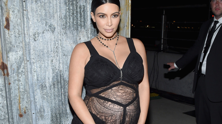 Kim Kardashian pregnant and posing