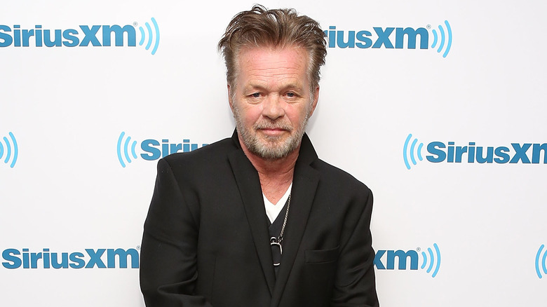 John Mellencamp, posing on the red carpet