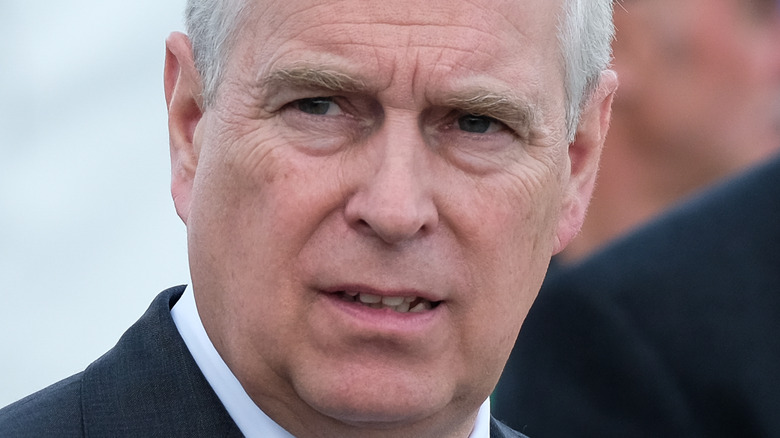 Prince Andrew scowling