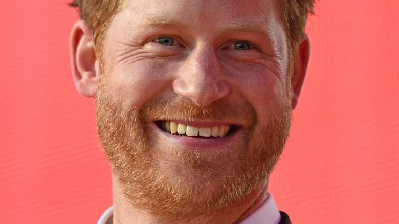 Prince Harry smiles at an event