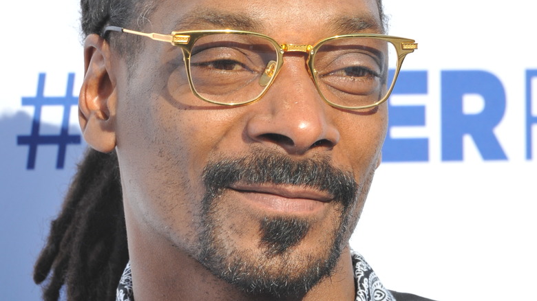Snoop Dogg gold glasses