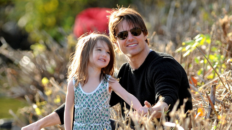 Tom and Suri Cruise at the Charles River Basin in 2009.