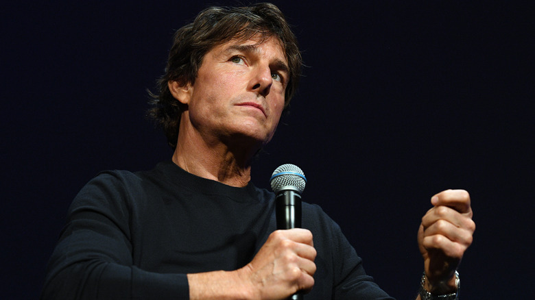 Tom Cruise pausing with microphone