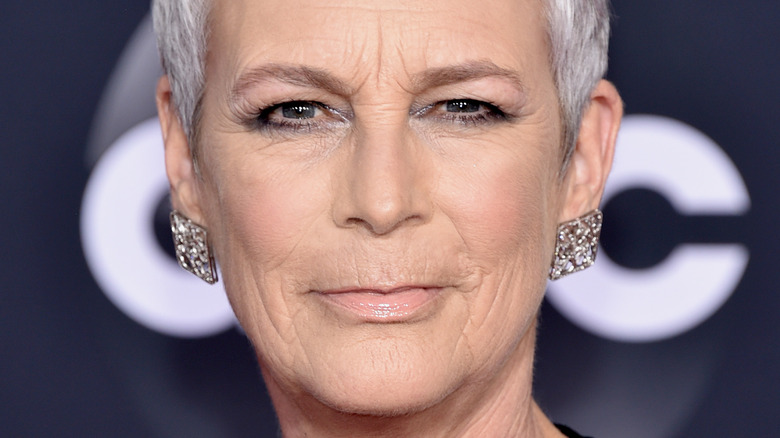 Jamie Lee Curtis poses in sparkly earrings