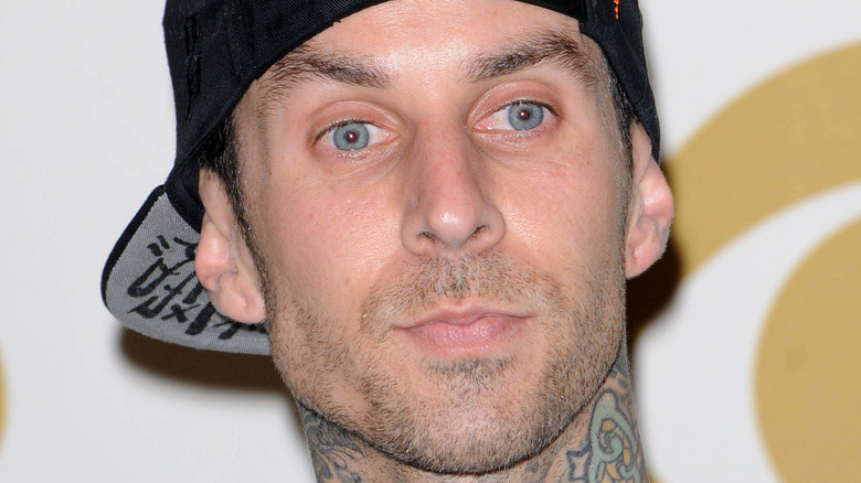 Travis Barker with a serious expression