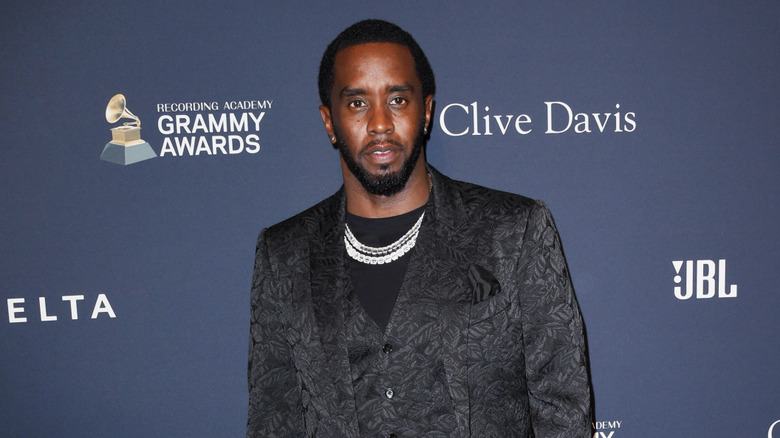 Diddy wearing a black suit