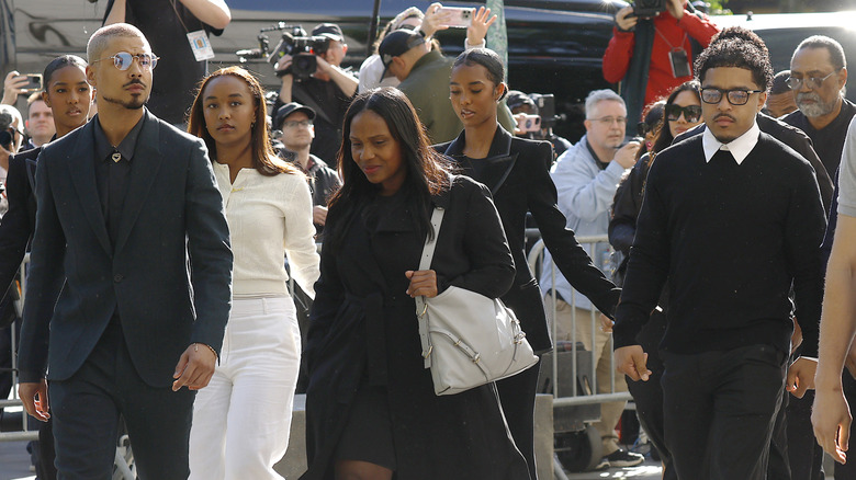 Diddy's kids walking outside of his trial