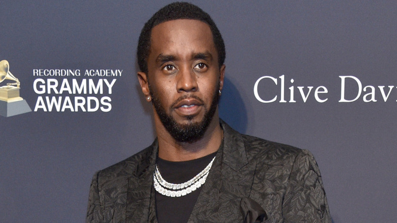 Diddy standing on the red carpet wearing black