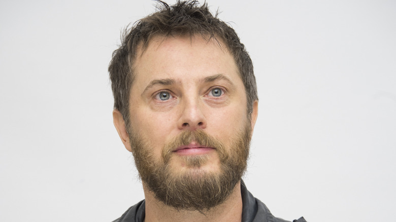 Duncan Jones with spiky hair at a 2018 press conference