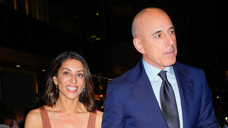 Matt Lauer looking to the side as Shamin Abas smiles at Don Lemon's wedding reception in 2024.