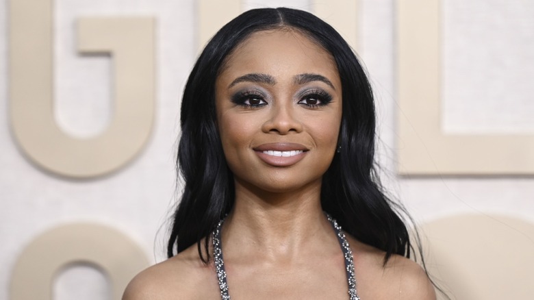 Sporting smoky eye makeup and soft wavy hair, Skai Jackson is all smiles.