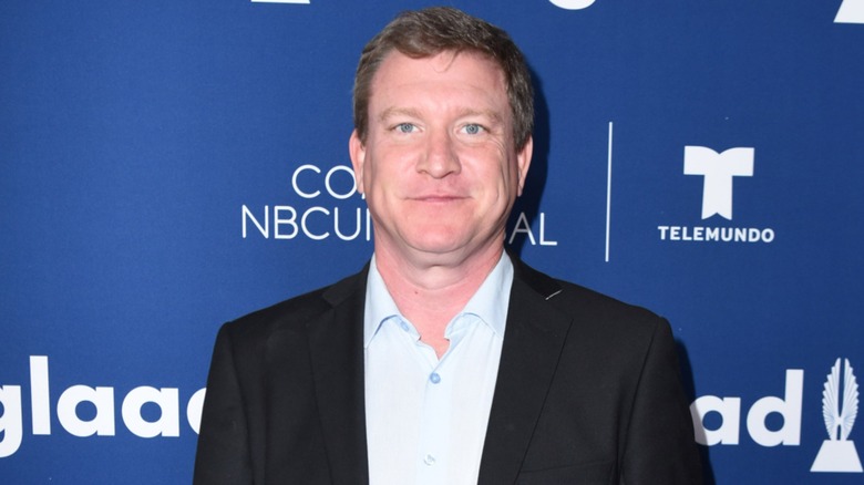 Dressed in a casual suit look, Stoney Westmoreland gives the camera a hard stare.