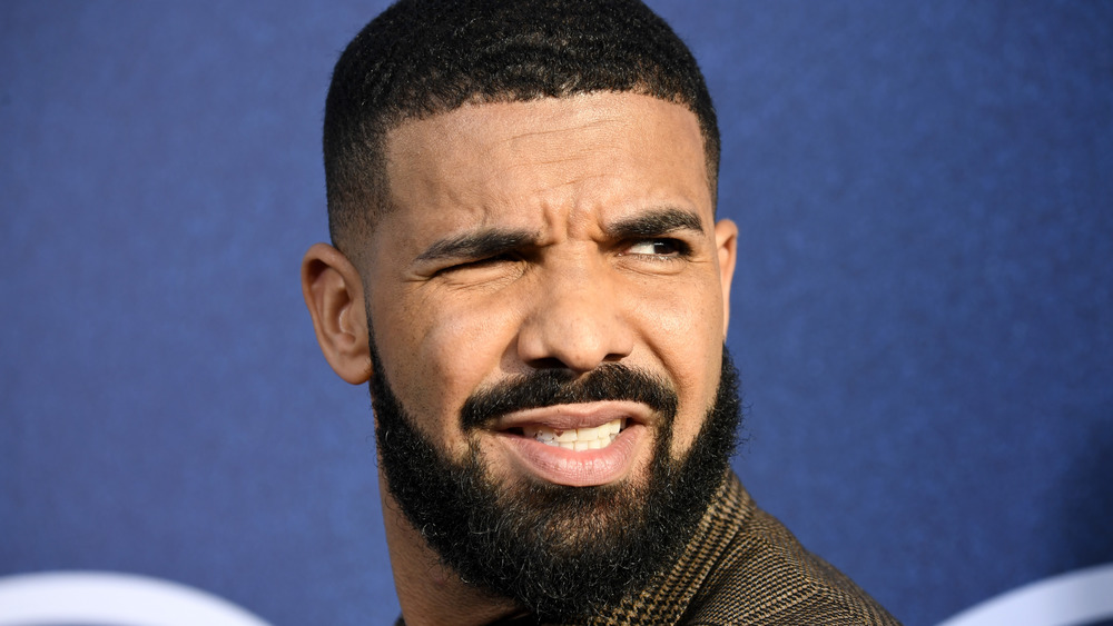 Drake grimacing