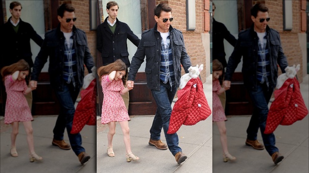 Tom Cruise and Suri walking
