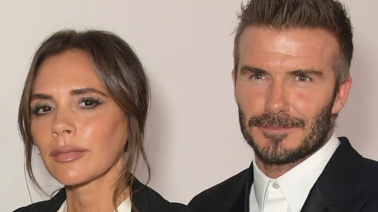 David and Victoria Beckham posing for photo