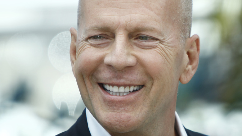 Bruce Willis smiling outside
