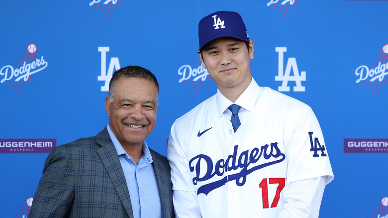 Dave Roberts and Shohei Ohtani stand together smiling