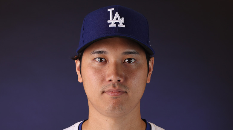 Shohei Ohtani wearing baseball cap in close-up portrait
