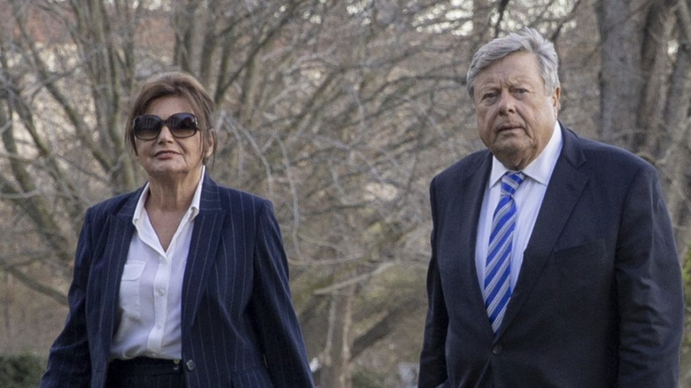 Viktor and Amalija Knavs wearing suits