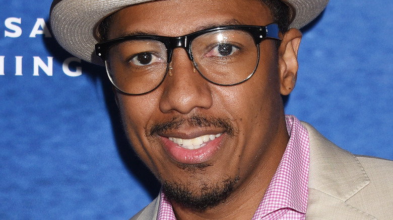 Nick Cannon with hat and glasses