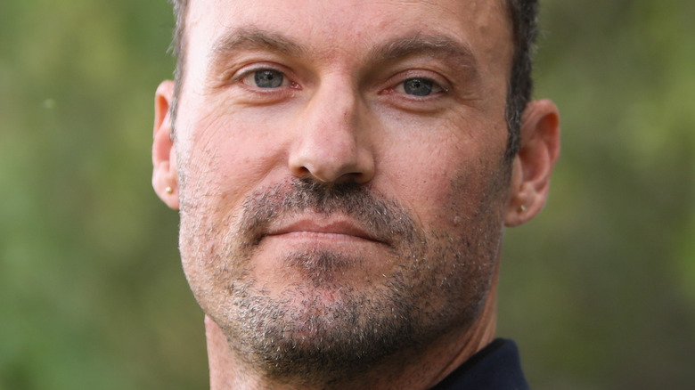 Brian Austin Green poses in natural setting