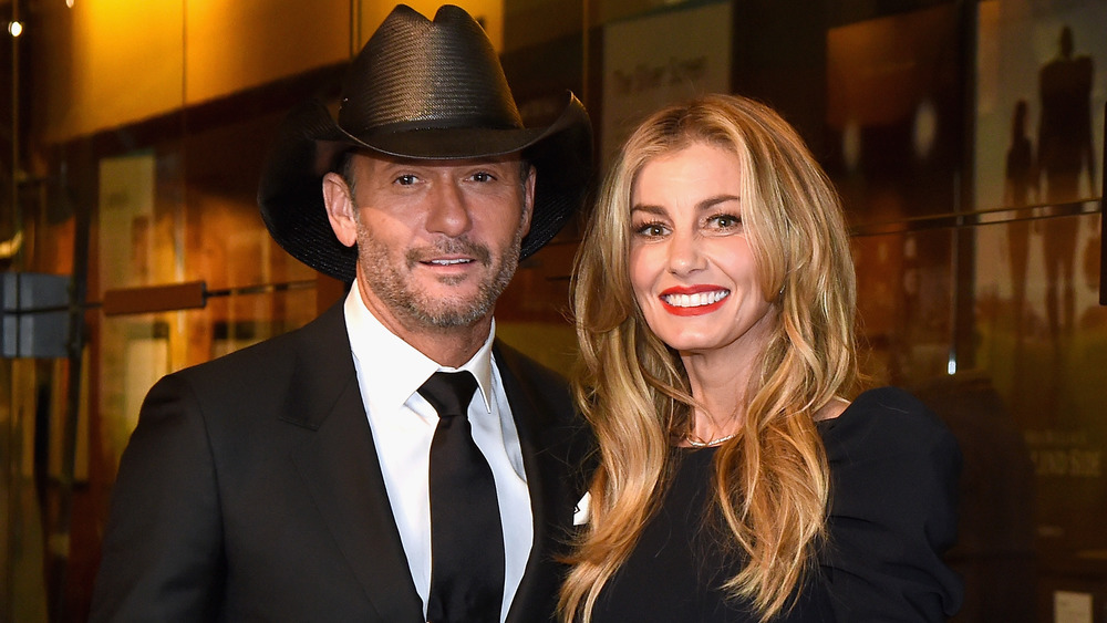 Tim McGraw and Faith Hill smiling at a Hollywood event