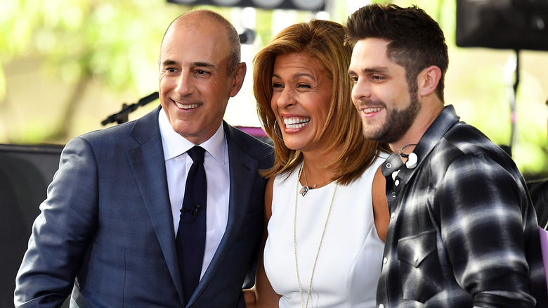 Hoda Kotb and Matt Lauer posing with Thomas Rhett