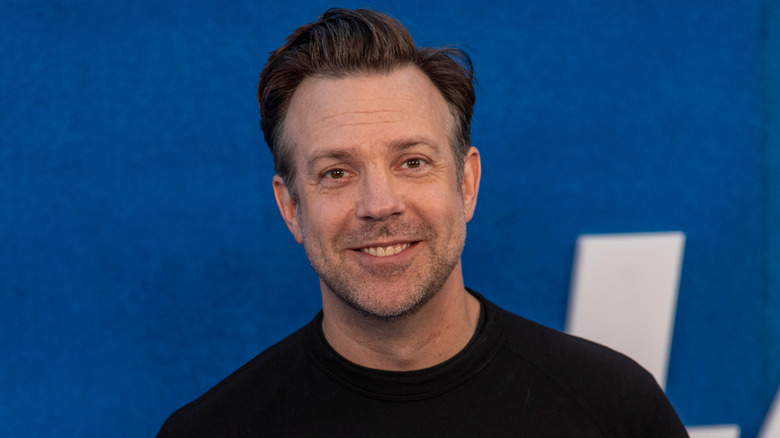 Jason Sudeikis smiling stubble beard