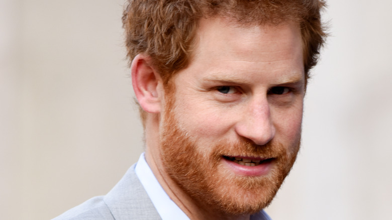 Prince Harry looks sideways at camera