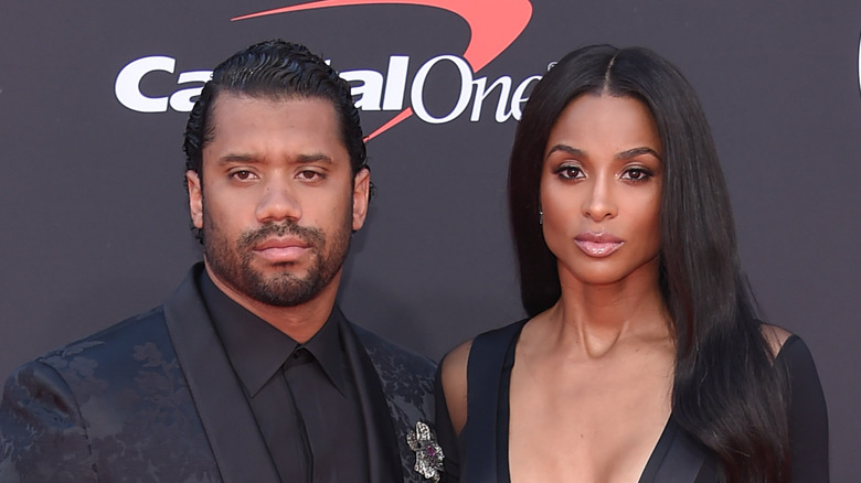 Russell Wilson and Ciara posing