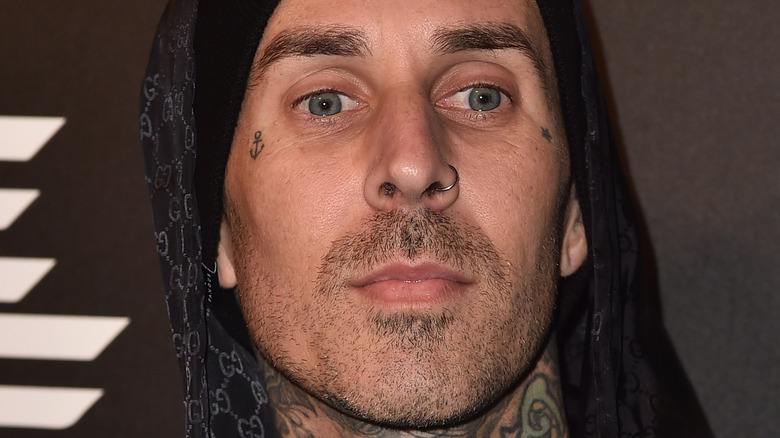 Travis Barker looking away