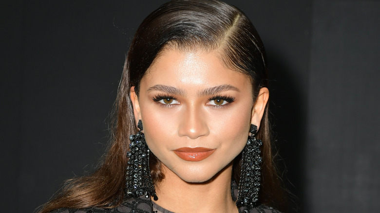 Zendaya poses in large black earrings