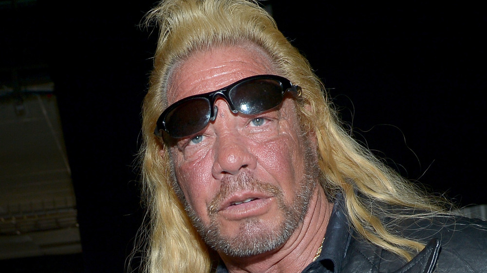 Dog the Bounty Hunter with his sunglasses on his forehead