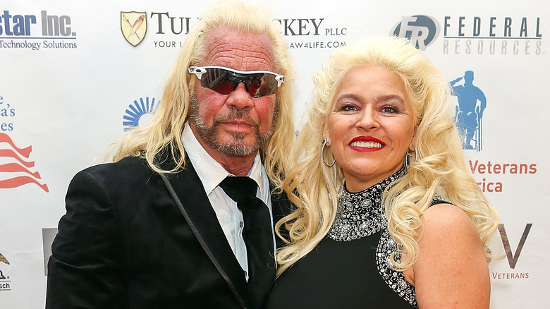 Duane "Dog the Bounty Hunter" Chapman and wife Beth posing