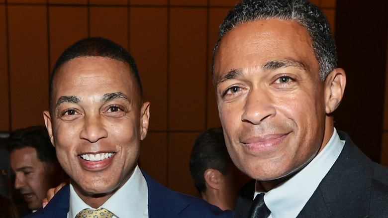 Don Lemon posing with T.J. Holmes