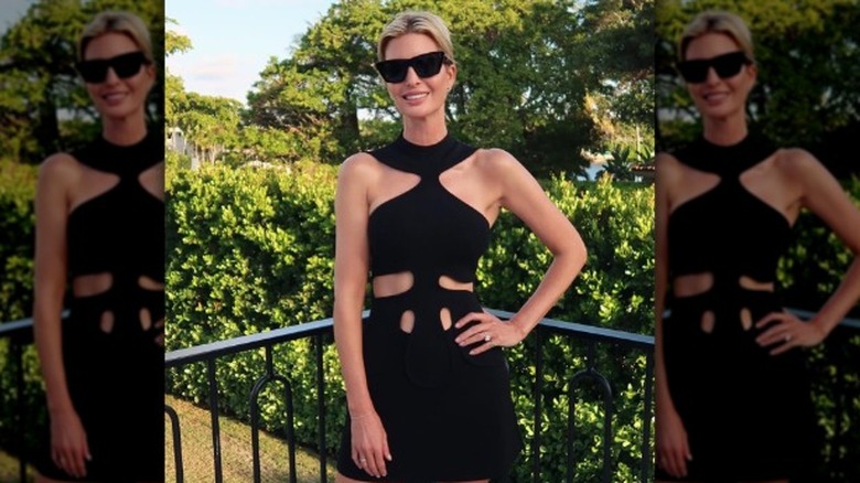 Ivanka Trump poses in black cutout dress while wearing wedding ring on right finger