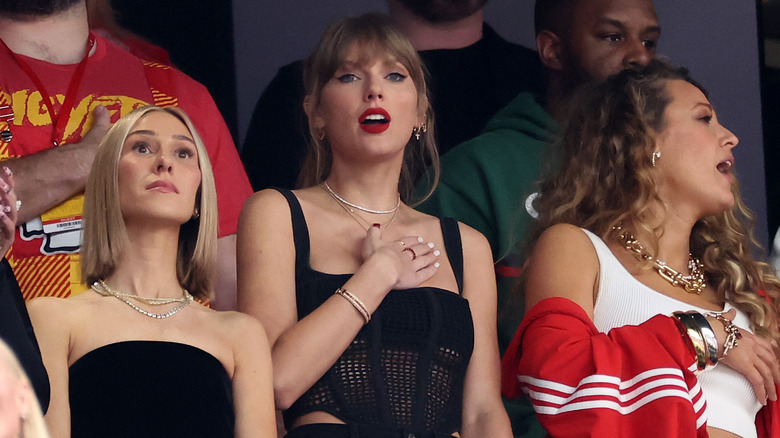 Taylor Swift with hand on chest