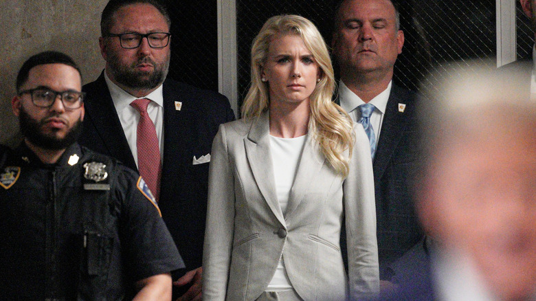 Natalie Harp wearing a gray suit